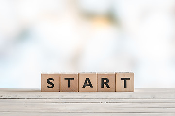 Image showing Start sign on a wooden table