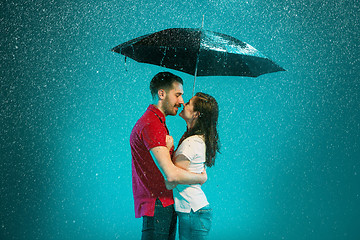 Image showing The loving couple in the rain