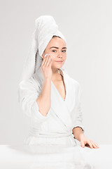 Image showing Woman cleaning face in bathroom