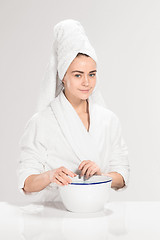 Image showing Woman cleaning face in bathroom