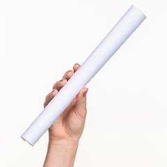 Image showing The cylinder female hands on white background