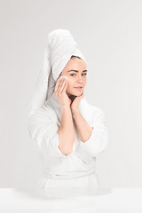 Image showing Woman cleaning face in bathroom