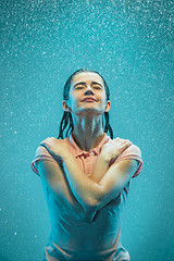 Image showing The portrait of young beautiful woman in the rain