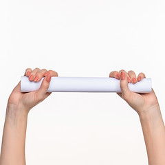 Image showing The cylinder female hands on white background