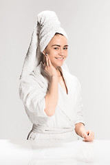 Image showing Woman cleaning face in bathroom