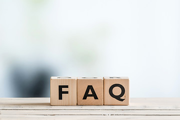 Image showing FAQ sign on an office table