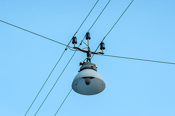 Image showing Old street lamp hanging on wires