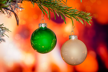 Image showing Christmas baubles on a pine branch
