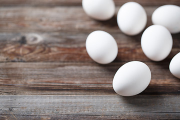 Image showing White eggs on the old wood table