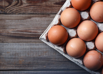 Image showing Brown eggs on a rustic wooden table