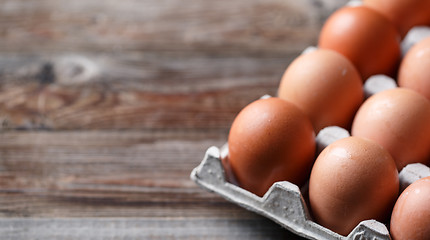 Image showing Brown eggs on a rustic wooden table