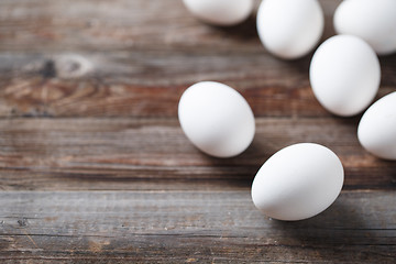 Image showing White eggs on the old wood table