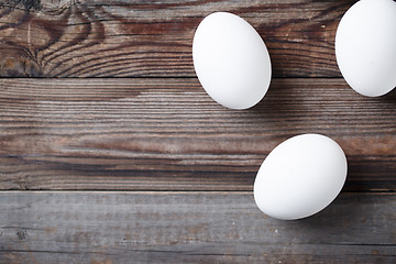 Image showing White eggs on the old wood table