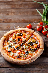 Image showing Pizza with tomato, mushroom and olives