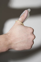 Image showing hand holding condom