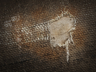 Image showing Detail (damage) of an old canvas suitcase, close-up