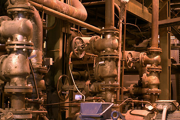 Image showing Equipment, cables and piping as found inside of a modern industr