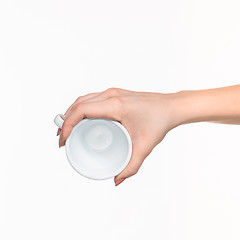 Image showing Woman hand with cup on white background