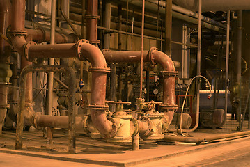 Image showing Equipment, cables and piping as found inside of a modern industr