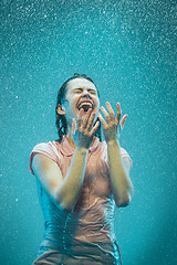 Image showing The portrait of young beautiful woman in the rain