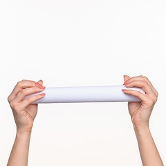 Image showing The cylinder female hands on white background