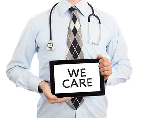 Image showing Doctor holding tablet - We care