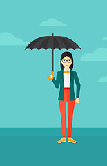 Image showing Business woman standing with umbrella.