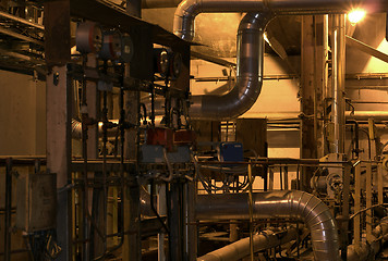 Image showing Equipment, cables and piping as found inside of a modern industr