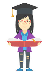 Image showing Woman in graduation cap holding book.