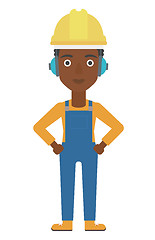 Image showing Woman wearing hard hat and headphones 