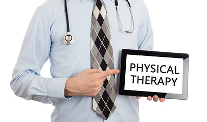 Image showing Doctor holding tablet - Physical therapy