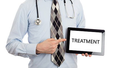 Image showing Doctor holding tablet - Treatment