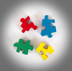 Image showing Closeup of 4 big jigsaw puzzle pieces