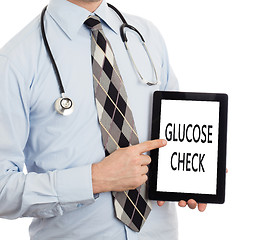 Image showing Doctor holding tablet - Glucose check