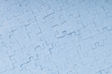 Image showing Connected blue puzzle pieces isolated