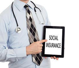 Image showing Doctor holding tablet - Social insurance