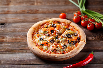 Image showing Pizza with tomato, mushroom and olives