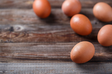 Image showing Brown eggs on a rustic wooden table