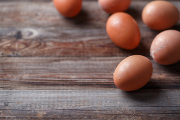 Image showing Brown eggs on a rustic wooden table