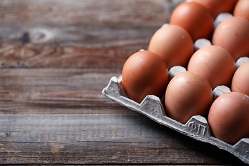 Image showing Brown eggs on a rustic wooden table