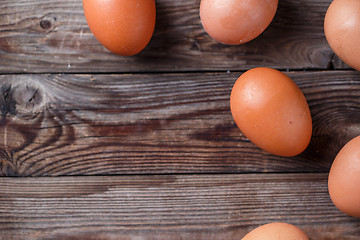 Image showing Brown eggs on a rustic wooden table