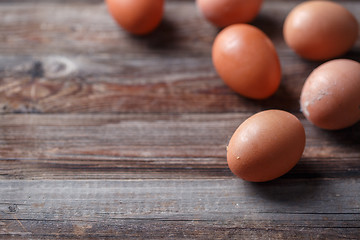 Image showing Brown eggs on a rustic wooden table