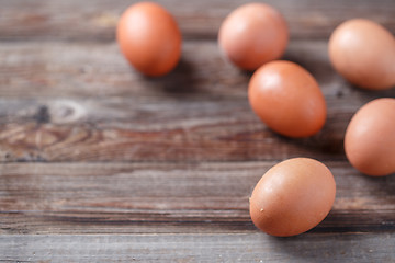 Image showing Brown eggs on a rustic wooden table