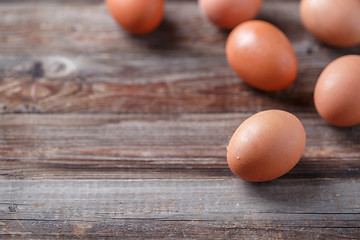 Image showing Brown eggs on a rustic wooden table