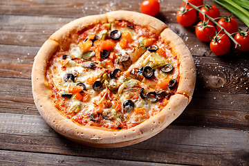 Image showing Pizza with tomato, mushroom and olives