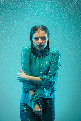 Image showing The portrait of young beautiful woman in the rain