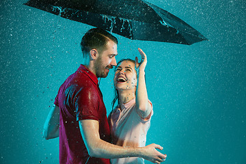 Image showing The loving couple in the rain