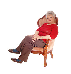 Image showing Senior lady resting in armchair.