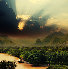 Image showing Sunset with rays over river