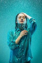 Image showing The portrait of young beautiful woman in the rain